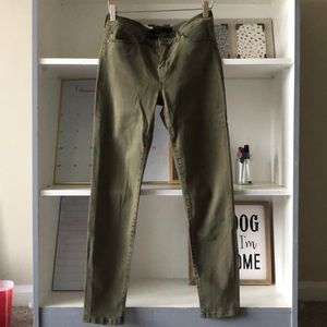 Olive green skinny jeans. Size 4.